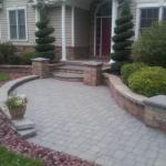 Stamford, 2015 - Stone Edging Install - Cut in edge with red slate stone to outline paver walkway 